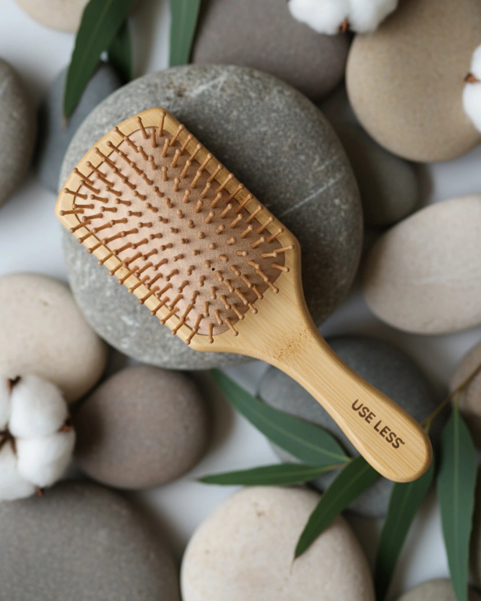 Eco-friendly paddle brush with gentle bristles for smooth, tangle-free hair, crafted for sustainable and plastic-free hair care.