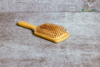 Eco-friendly paddle brush with gentle bristles for smooth, tangle-free hair, crafted for sustainable and plastic-free hair care.
