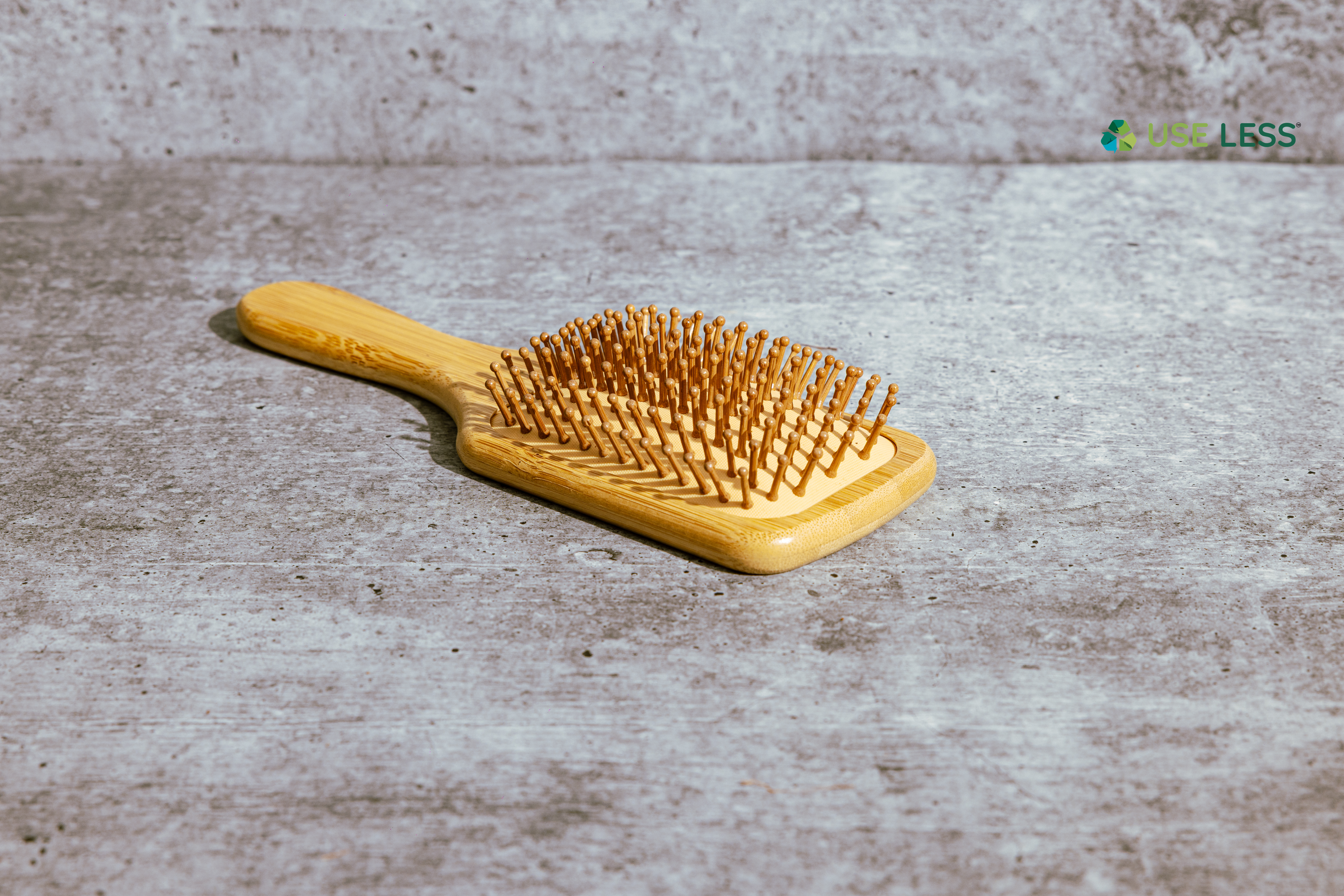 Eco-friendly paddle brush with gentle bristles for smooth, tangle-free hair, crafted for sustainable and plastic-free hair care.