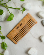 Eco-friendly bamboo shampoo comb. Sustainable, plastic-free hair detangling and grooming tool
