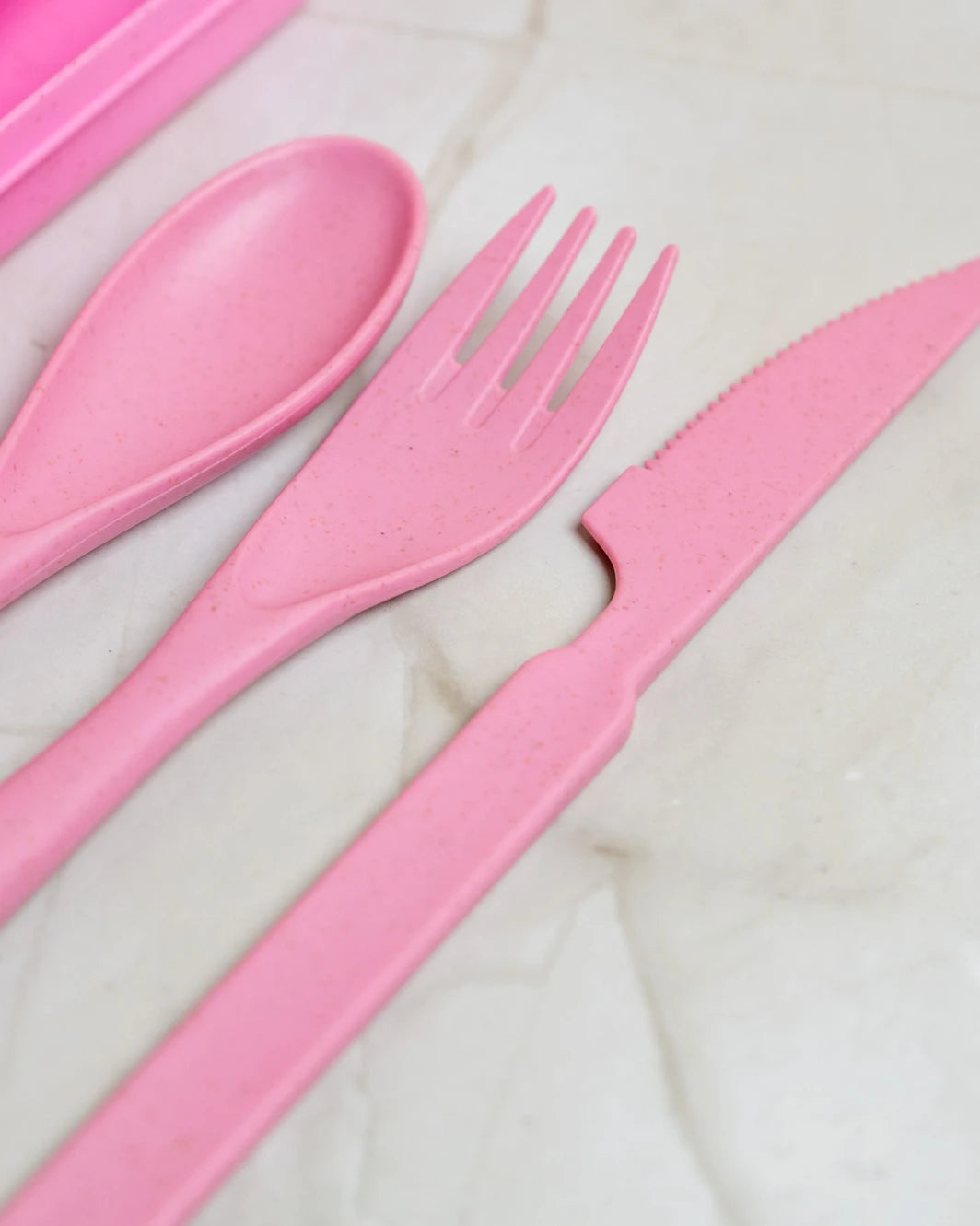 Eco-friendly travel cutlery set with reusable stainless steel utensils, compact and sustainable for zero-waste meals on the go.